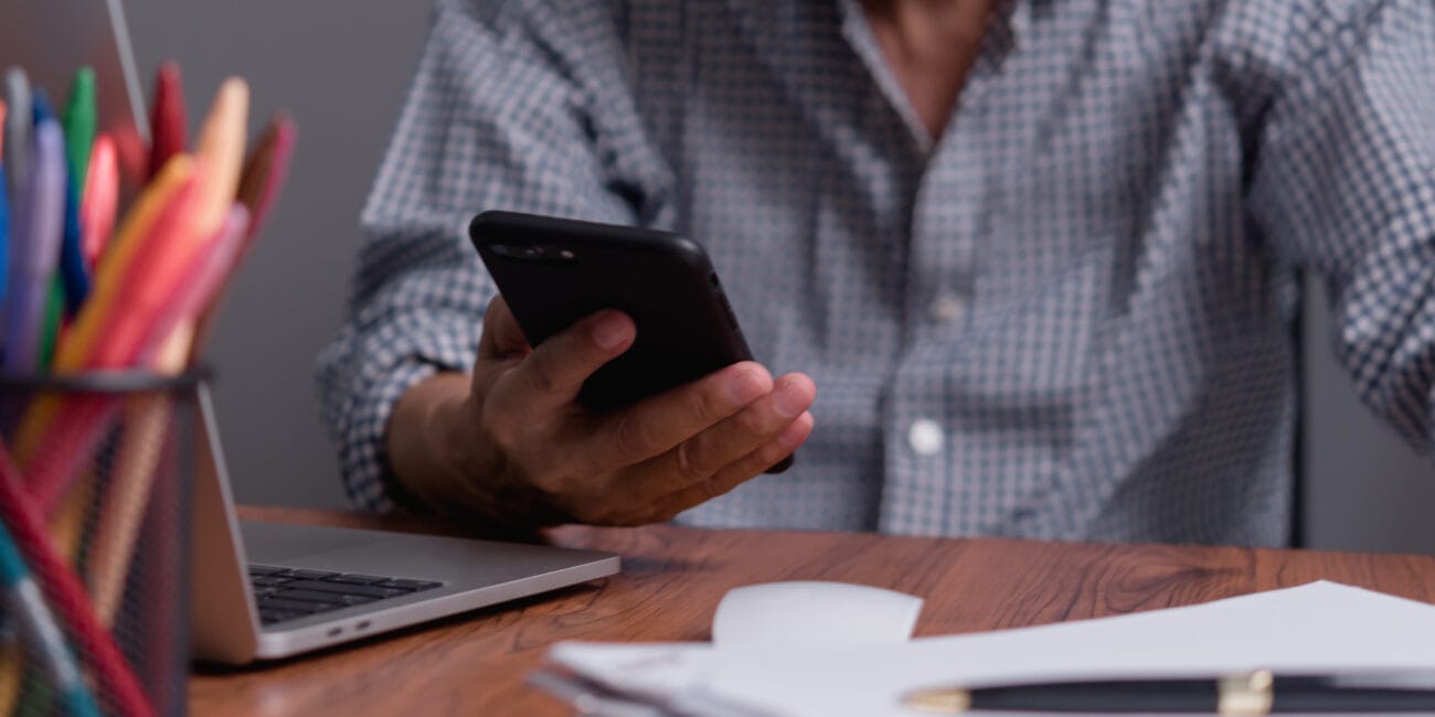 Asian senior businessman using mobile phone for work and communication